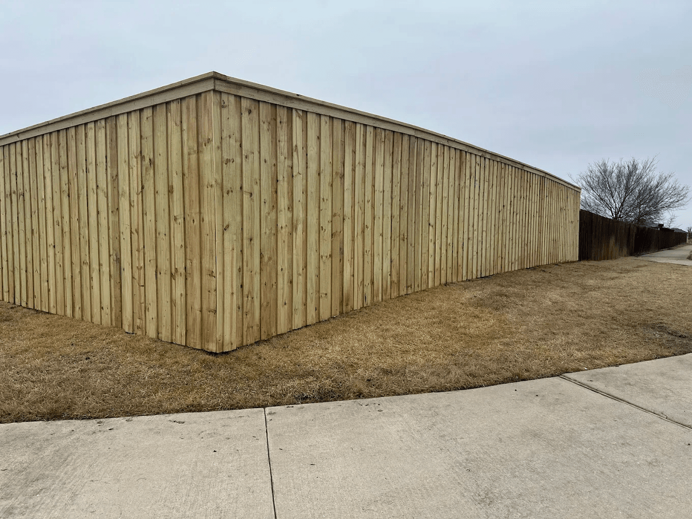 Cedar fence installation by Bulletproof Roofing